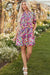 Mini-robe fleurie rose à manches courtes et col en V
