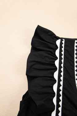 Contrasto nero ricrac rivestimento a v rotto a v collo in peplo