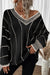 Maglione sciolto a Vs a striato di blocco nero a strisce