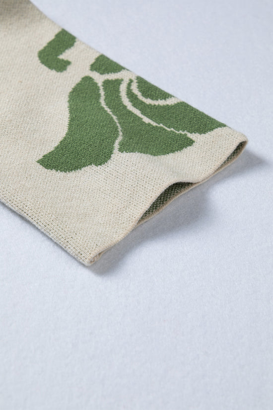 Suéter largo bege com estampa de flores em negrito e manga larga