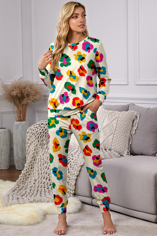Top a manicotto lungo a manicotto leopardo di albicocche e pantaloni magri