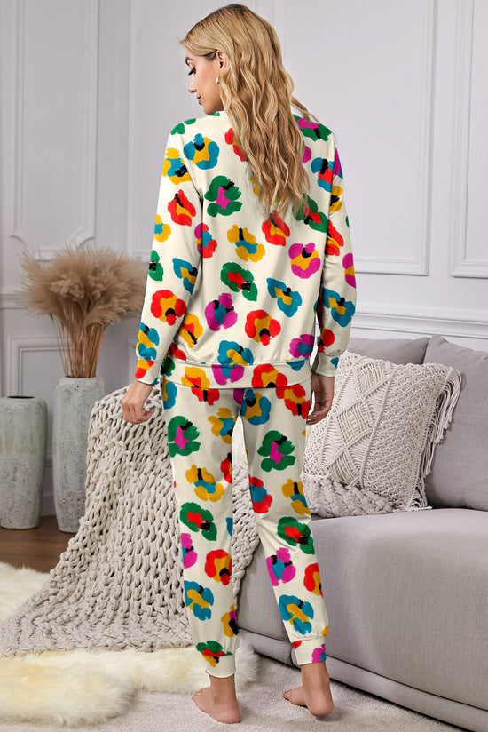 Top a manicotto lungo a manicotto leopardo di albicocche e pantaloni magri