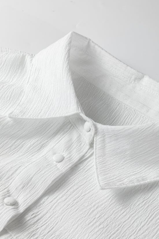 Chemise ample boutonnée blanche à manches lanternes et texture froissée