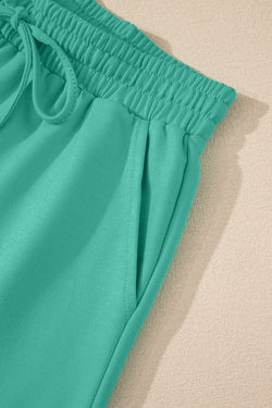 Meadow Mist Green Solid Sole Lo suelto V Neck Media manga y pantalones pantalones cortos