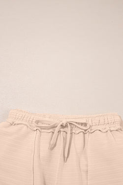 Camisa y pantalones cortos con cuello con textura de color naranja