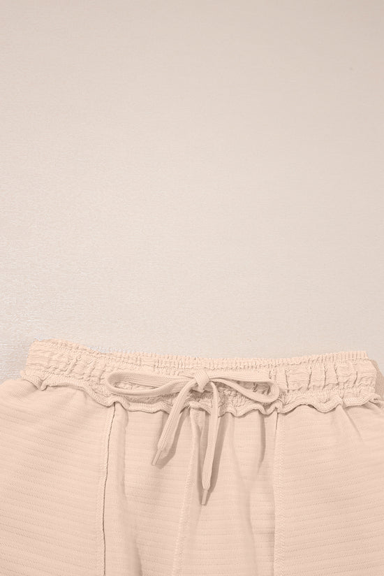 Taglie e pantaloncini a Viatura a Vagiatura arancione e pantaloncini