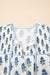 Mini vestido floral azul celeste com manga bufante amarrada no pescoço e bolso