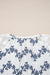 Chemisier bleu en dentelle patchwork floral à manches bulles et col fendu