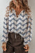 Chemisier bleu en dentelle patchwork floral à manches bulles et col fendu