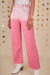 Pantaloni in denim rosa scattering di strass