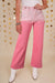 Pantaloni in denim rosa scattering di strass