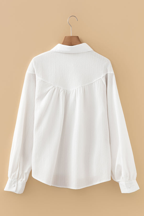 Chemise ample boutonnée blanche à manches lanternes et texture froissée