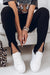 Leggings con spacco a vita alta in maglia a coste nere