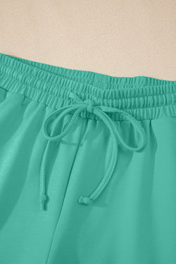 Meadow Mist Green Solid Sole Lo suelto V Neck Media manga y pantalones pantalones cortos