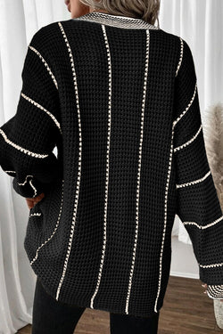 Maglione sciolto a Vs a striato di blocco nero a strisce