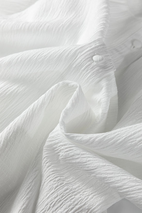 Chemise ample boutonnée blanche à manches lanternes et texture froissée