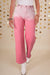 Pantaloni in denim rosa scattering di strass