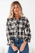 Chemise boutonnée noire à imprimé écossais avec poches poitrine