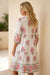 Robe longue blanche à imprimé floral et demi-bouton col mandarin manches 3/4