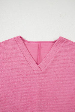 Camisa y pantalones cortos con cuello con textura de color naranja