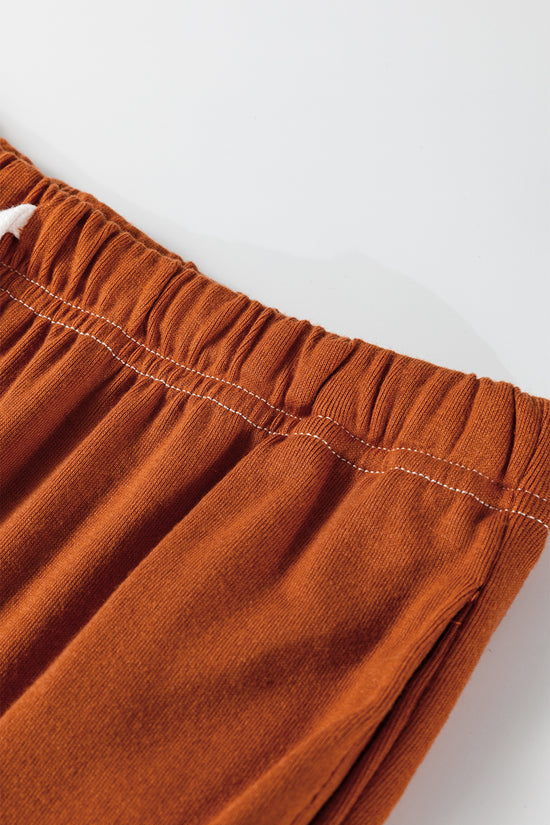 Coux de contraste orange de pamplemousse sur le cou à manche en V bouton