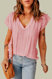 Top a V bullo a livello rosa arruffato
