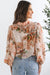 Camisa ligera con mangas abullonadas y estampado floral naranja