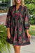 Robe babydoll noire à imprimé floral et col cranté avec bordure passepoilée et manches bracelet