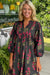 Robe babydoll noire à imprimé floral et col cranté avec bordure passepoilée et manches bracelet