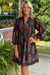 Robe babydoll noire à imprimé floral et col cranté avec bordure passepoilée et manches bracelet