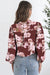 Camisa ligera con mangas abullonadas y estampado floral naranja