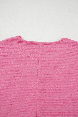 Camisa y pantalones cortos con cuello con textura de color naranja
