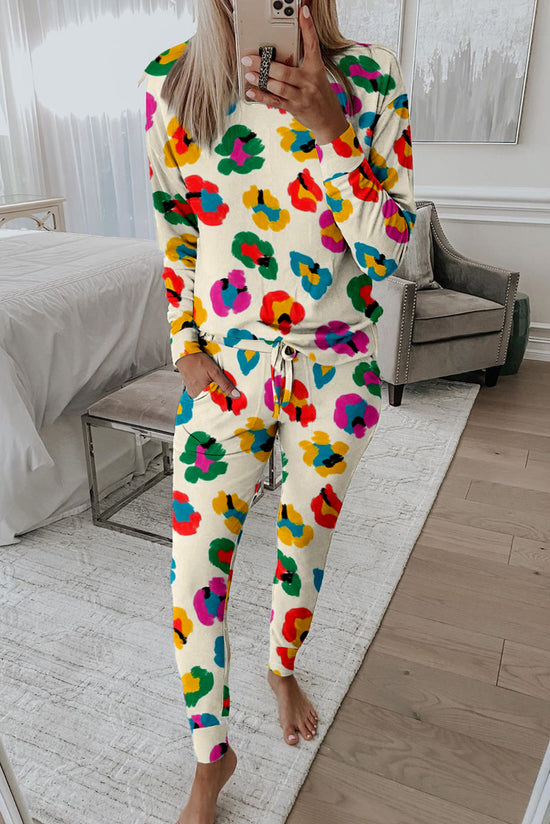 Top a manicotto lungo a manicotto leopardo di albicocche e pantaloni magri
