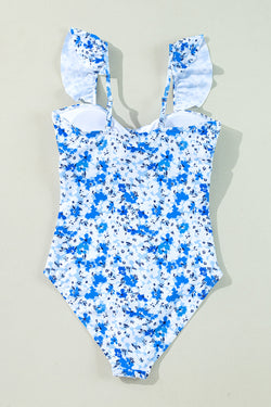 Cingcio blu floreale con lana in cima a cavo out un costume da bagno con un pezzo
