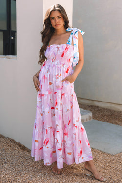 Robe maxi à l'épaule nouée à imprimé floral rose