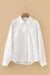 Chemise ample boutonnée blanche à manches lanternes et texture froissée